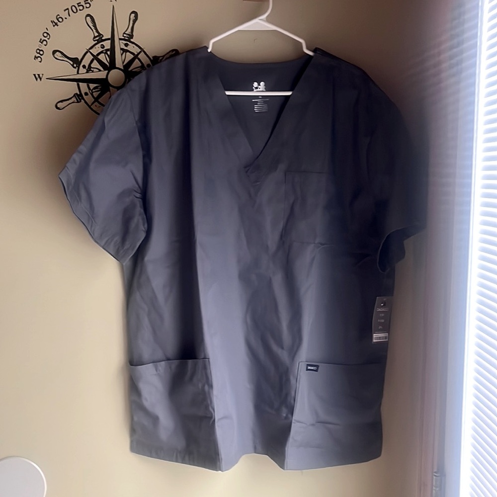 New with tags. Gray scrub top , size 2XL. Dagacci, excellent condition